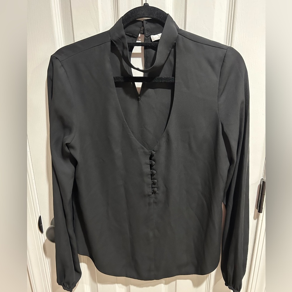 Women’s black blouse with button details